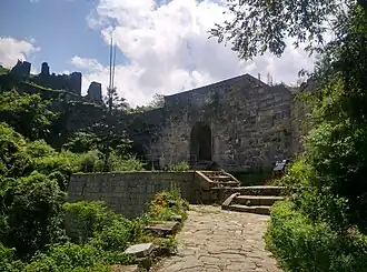 A stone fortress on the slopes of a hill
