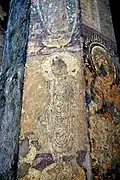 The Buddha in long, heavy robe, a design derived from the art of Gandhara[175]
