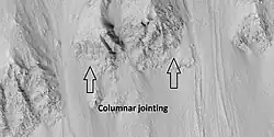 Close view of crater wall with columnar jointing labeled Picture taken with HiRISE.
