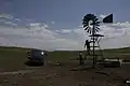 Checking a windmill on Spade Ranch summer range (c. 2009)