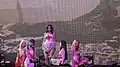 (G)I-dle in floral dresses incorporated with traditional Korean folk motif outfits for the theme a tragic HEROiNE.