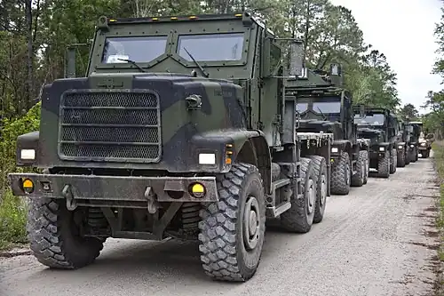 This Oshkosh MTVR MK23/MK25, on which the Oshkosh TAK-4 independent coil-spring suspension is clearly visible, is fitted with an armored cab.