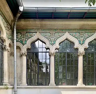 Polychrome ceramic tiles with foliage spirals (aka rinceaux) in the courtyard of the Central Girls' School, Bucharest, by Ion Mincu, 1890[55]