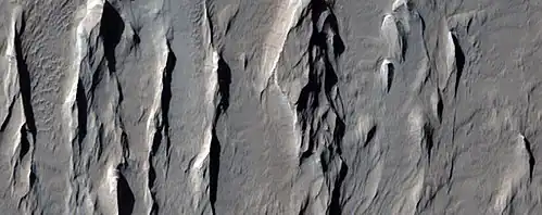 Close view of yardangs in previous image, as seen by HiRISE under HiWish program Location is Memnonia quadrangle.