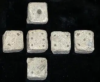 Composite image of all sides of a 12 mm (1⁄2 in) Roman die, found in Leicestershire, England