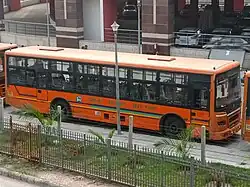 A bus of the Yamuna Sarthi Bus Seva at the Botanical Garden metro station