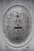 The Hustler family coat of arms seen as part of the stucco ceiling decoration.