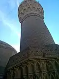 Ground level view of the first bands of the muqarnas and the Abbasid decorations