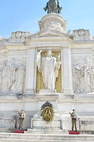 Tomb of the Italian Unknown Soldier, under the statue of goddess Roma, at Altare della Patria, Rome. Above it can be seen the equestrian statue of Victor Emmanuel II of Savoy, the first king of a unified Italy