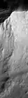 Northern face of Anseris Mons showing areas of exposed bedrock.
