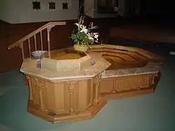 The baptismal font at St. Raphael's Cathedral, Dubuque, Iowa, was expanded in 2005 to include a small pool for immersion of adults.