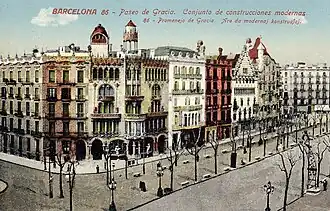the same row of houses with added ornamentation and decorative turrets