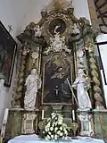 Coat of arms on the altar in the Church of Saint Peter of Alcántara