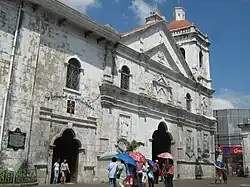 Historical marker attached to the façade of a structure