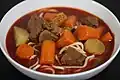 Bò kho with carrots, radishes, beef tripe and mì