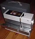 Model D 40 straight tray slide projector (1961)[d][nb 1]