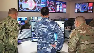 The primarily blue colour scheme of the General Purpose Uniform, seen from behind.
