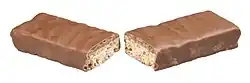 A Whatchamacallit candy bar broken in half.