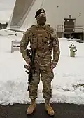 Member of Air Force Security Forces standing watch in front of the PAVE PAWS installation at Cape Cod SFS, 2021