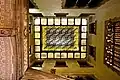 Looking up from the Casa Amatller's stair court, at the stained glass ceiling above.