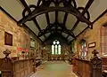 Chancel showing bench ends
