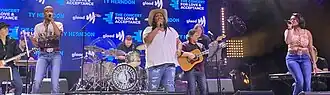 Country music group Chapel Hart performing onstage.