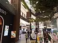 A circular corridor of the mall, surrounding the Balai Sarbini structure