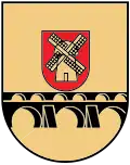 A coat of arms depicting a yellow windmill on a red crest hovering over a black bridge all on a yellow background
