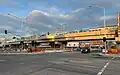 Coolstore Road after grade separation—North-east bound train over the Coolstore Road rail bridge, Croydon station, July 2024