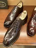 Contrast with plain toe oxfords