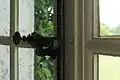 Rod handle (Ruderstange) on the window of the library in a pavilion of Palace of Versailles