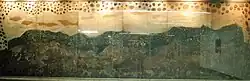 Picture of a mural titled Cuitzeo, which depicts two pumas seeing some archaic edifications.