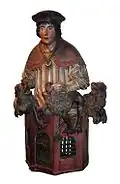 Daniel in the lion's den. Polychrome carved wood, Saint-Sauveur Cathedral, Bruges, 10th century.
