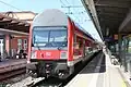 2. Generation Doppelstockwagen in DB Verkehrsrot [de] colours on a Rostock S-Bahn service (July 2013)