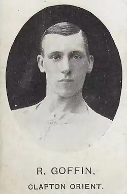 Grainy black and white photograph of a dark-haired young man in a football shirt