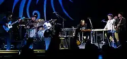 Bob Dylan together with four members of his band onstage.