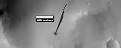 New streak that was caused by a recent impact that created a small crater, as seen by HiRISE. Location is the Arabia quadrangle.