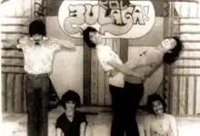 A monochrome image of five people.