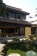 Townhouse with black (edoguro) colouring to upper floor