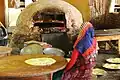 A traditional oven used to bake it