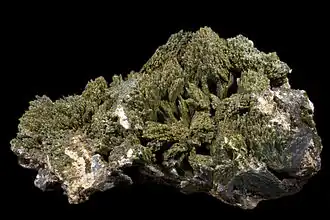 Image 19Epidote often has a distinctive pistachio-green colour. (from Mineral)
