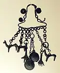 Iron Age, Piceni, Mid-Adriatic and Southern Italian jewellery, c.800-690 BC, pendant with horses, bulles and hands