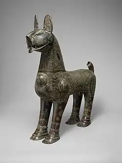 "A demonstration of the excellence achieved in metalwork under the Seljuqs": bronze incense burner shaped like lion, with removable head, dated 1181–82 CE, Taybad, Iran. (Metropolitan Museum of Art)[176][177]
