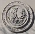 The First Seal on the facade of Marston Hall (1926).