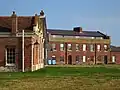 Officers' Quarters (right, 1865)[16]