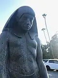 Statue out front of PRS with inscription "Thou sun, who has covered the truth with thy golden disc, do thou remove the veil so that I may see the truth within thee and know the meaning of thy rays of glory for the truth which is within thee is within me, and I am that."