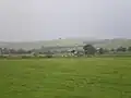Pasture meadow (foreground) and football pitch in Volica (background)