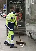 Street sweeper at the bus stop in Parkallé in Aarhus