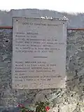 Commemorative plaque on the wall of the Citè du Carcassonne cemetery.