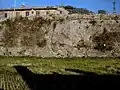 The "Walls of the Walled Gate," overlooked by the ruins of the Batteria Angeli